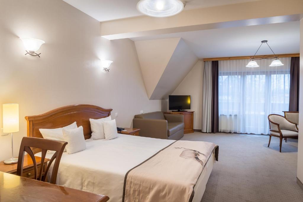 Posteľ alebo postele v izbe v ubytovaní Hotel Nosalowy Dwór