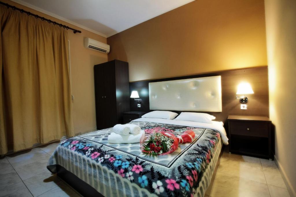 Postel nebo postele na pokoji v ubytování Hotel Epavli