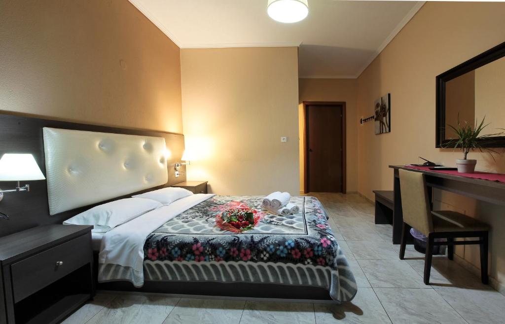 Postel nebo postele na pokoji v ubytování Hotel Epavli