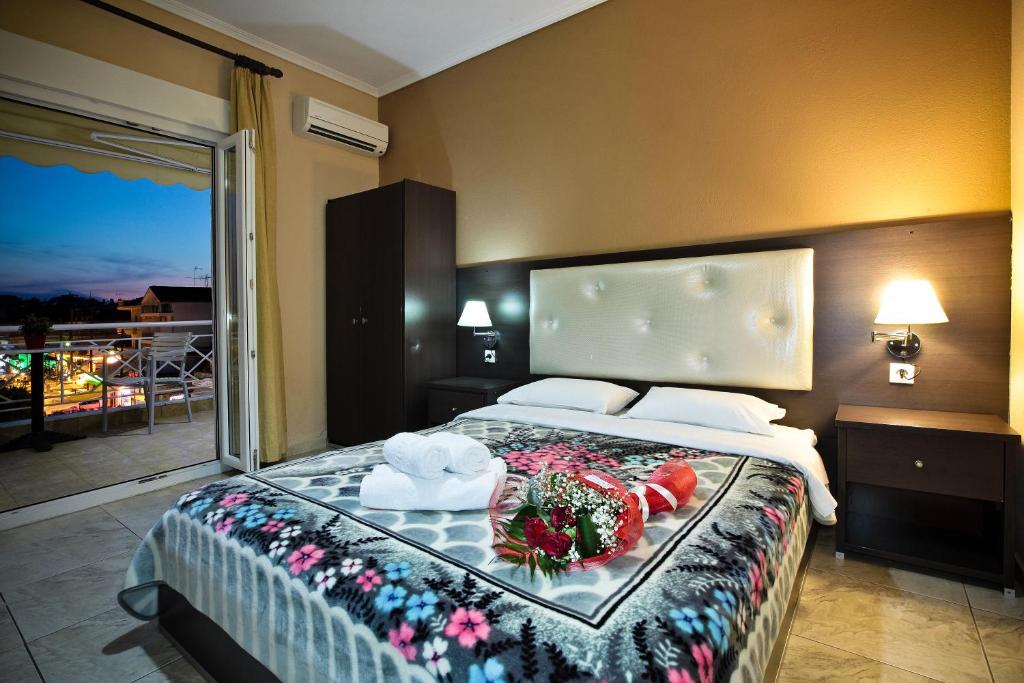 Postel nebo postele na pokoji v ubytování Hotel Epavli