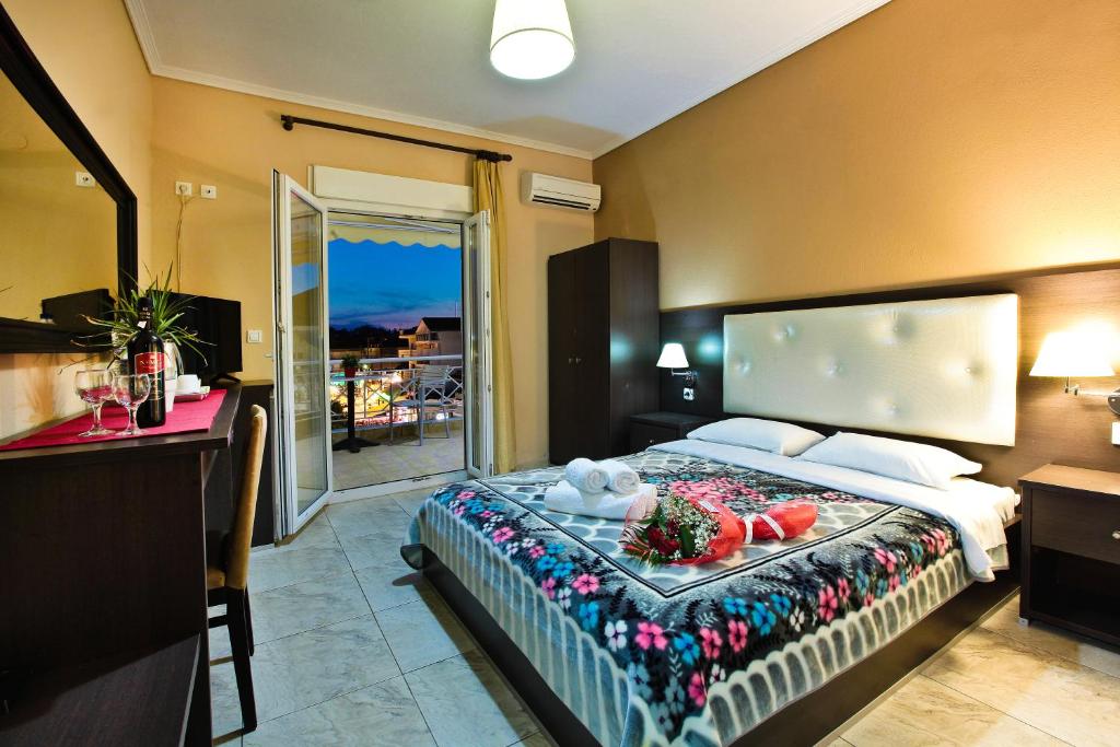 Postel nebo postele na pokoji v ubytování Hotel Epavli