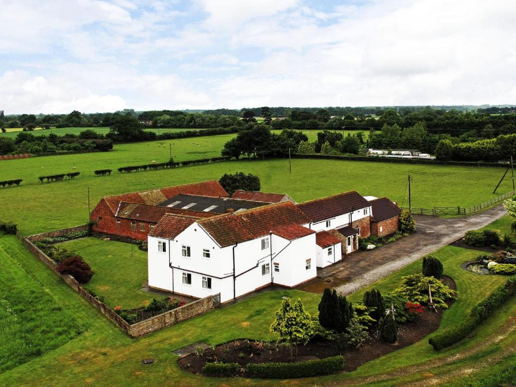 an aerial view of a house in a field at Deighton Lodge in York