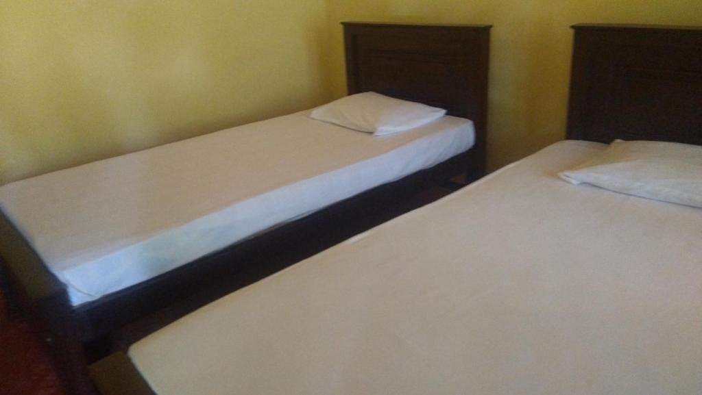 Postel nebo postele na pokoji v ubytování Araliya land Resort Dambulla