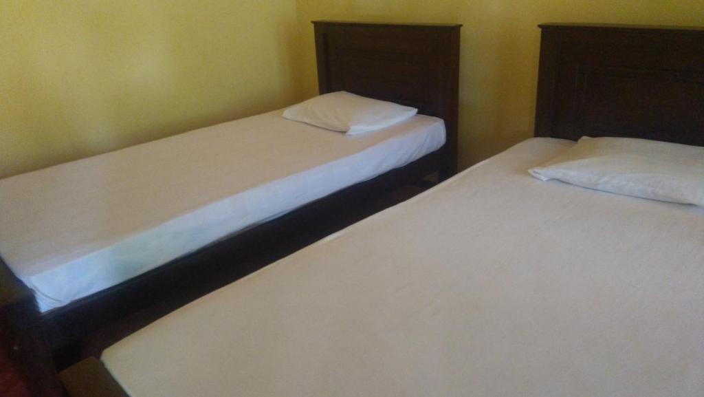 Postel nebo postele na pokoji v ubytování Araliya land Resort Dambulla