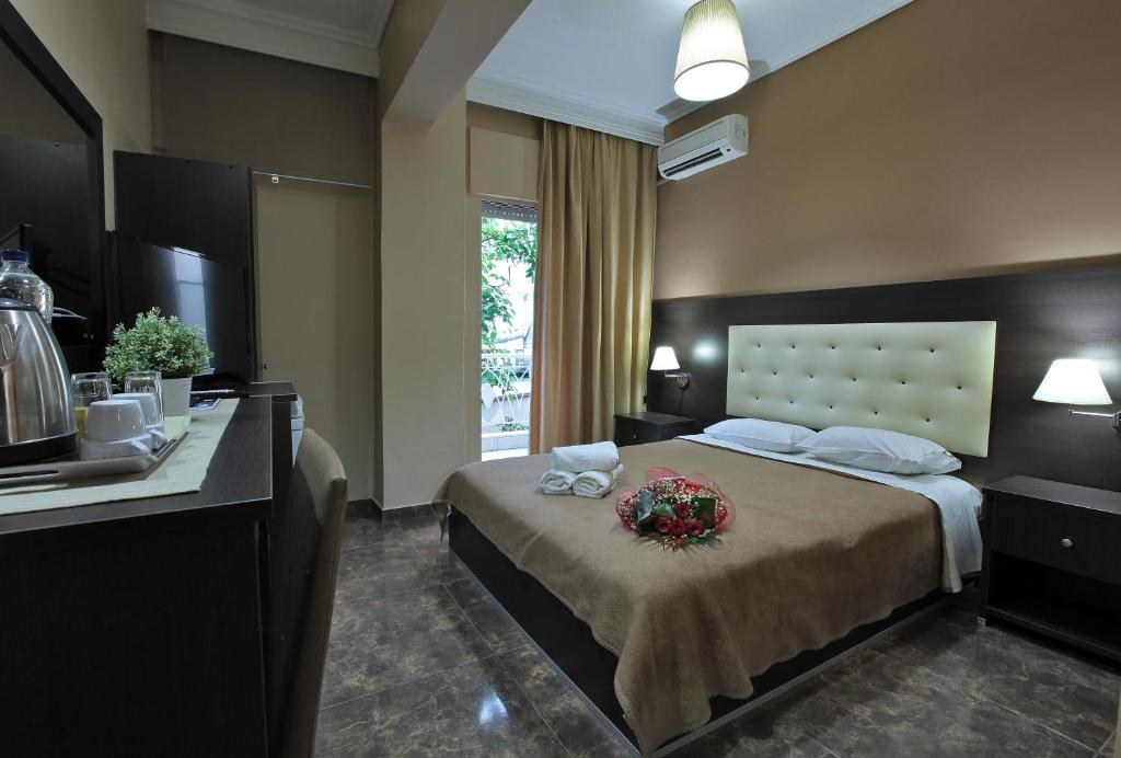 Postel nebo postele na pokoji v ubytování Hotel Epavli