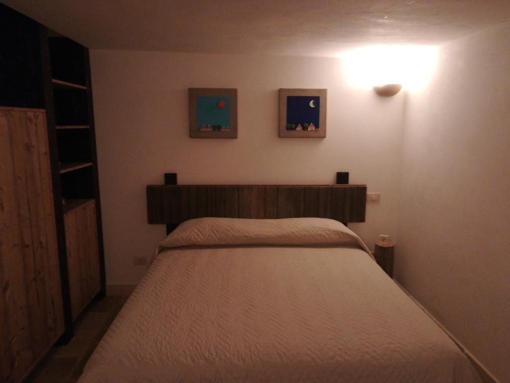Postel nebo postele na pokoji v ubytování Trulli & Grotte Exclusive House