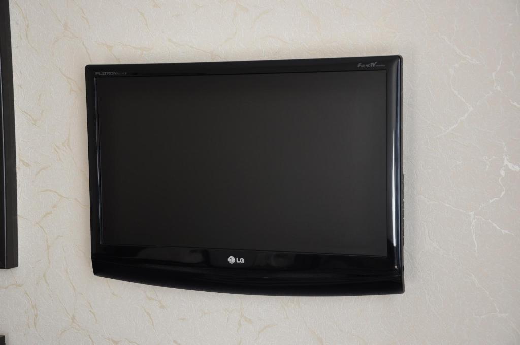 TV a/nebo společenská místnost v ubytování Light House