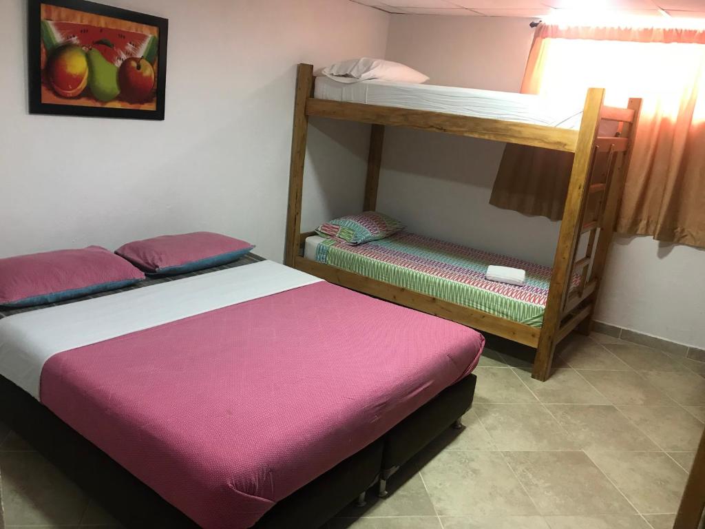 Postel nebo postele na pokoji v ubytování Hostal El Hangar