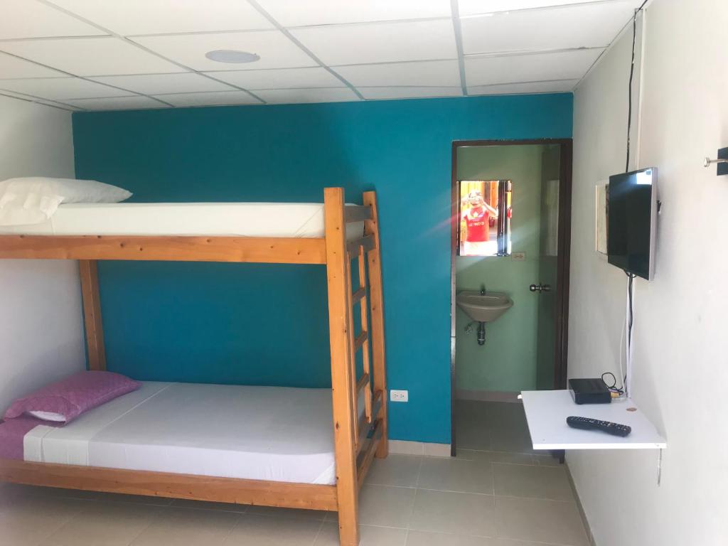 Postel nebo postele na pokoji v ubytování Hostal El Hangar