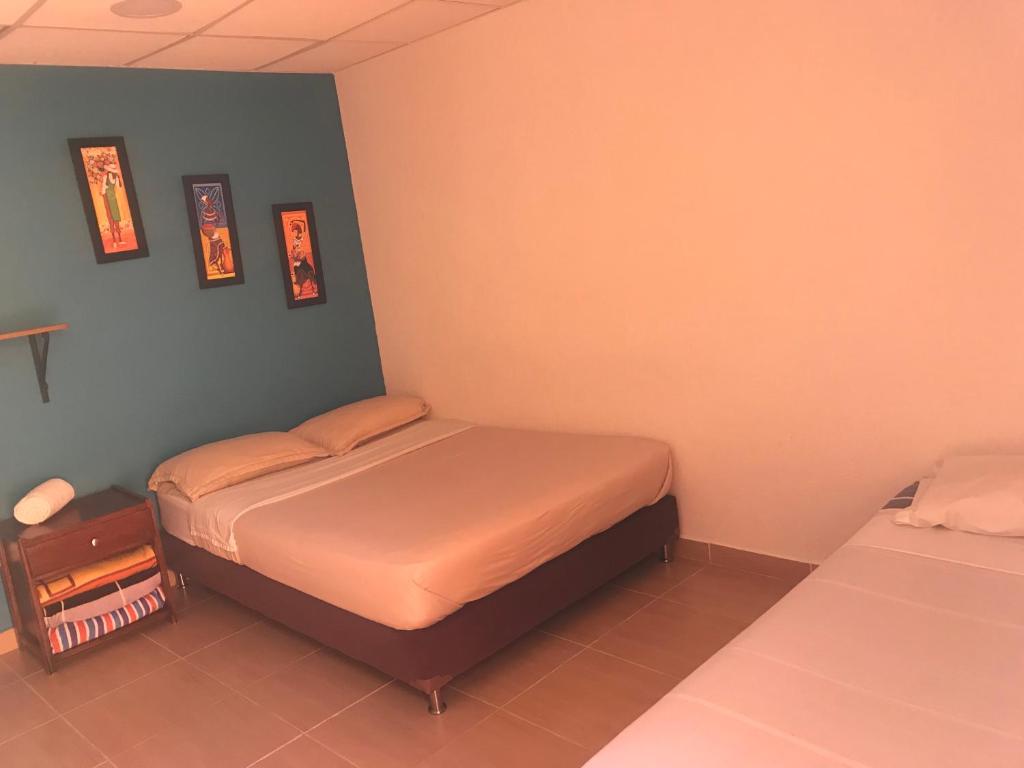 Postel nebo postele na pokoji v ubytování Hostal El Hangar