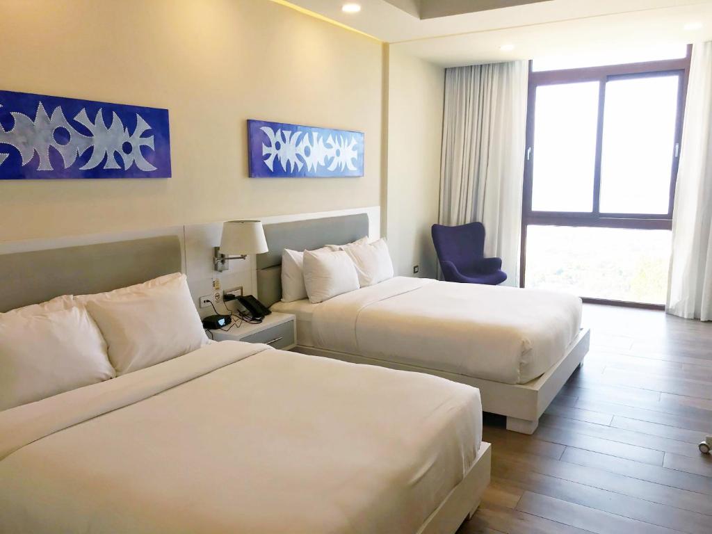 Postel nebo postele na pokoji v ubytování Satama Hotel