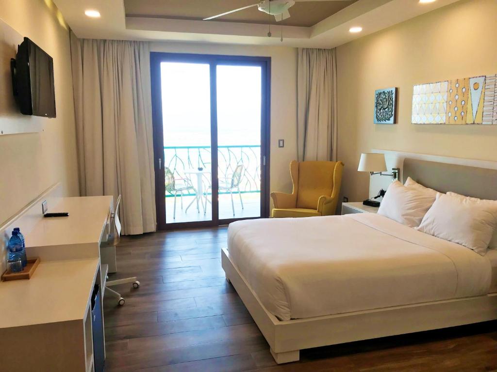 Postel nebo postele na pokoji v ubytování Satama Hotel