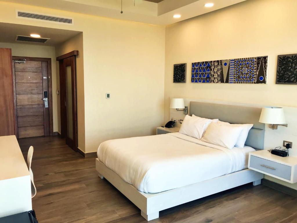 Postel nebo postele na pokoji v ubytování Satama Hotel