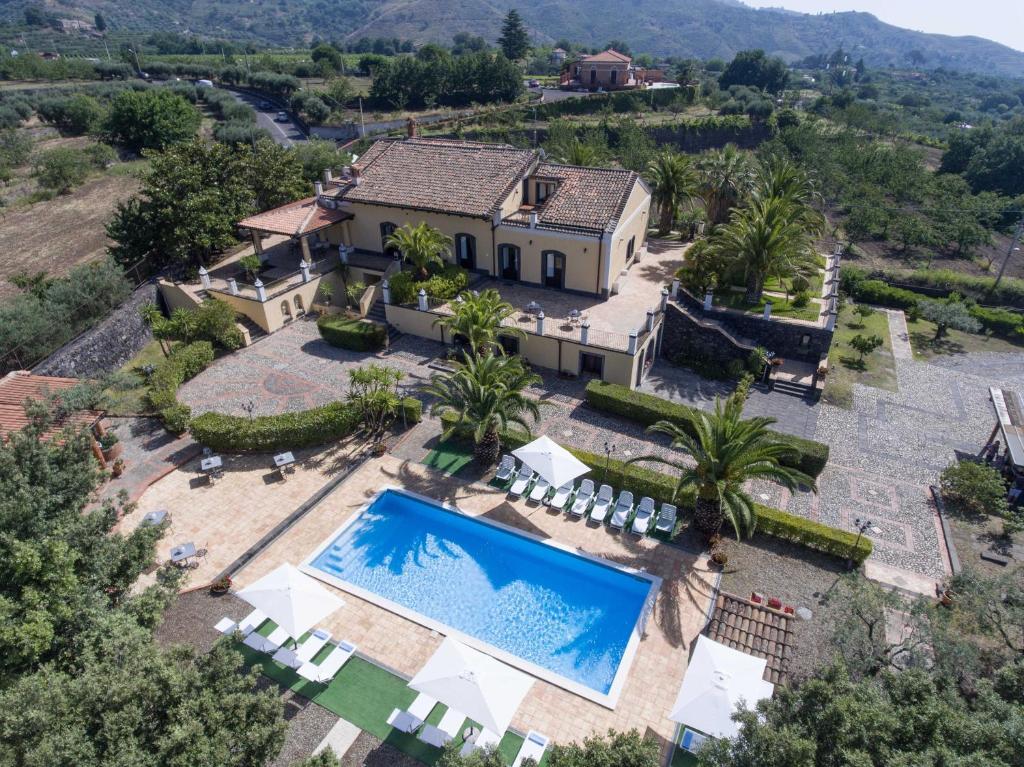 an aerial view of a house with a swimming pool at Villa San Gerardo in Piedimonte Etneo