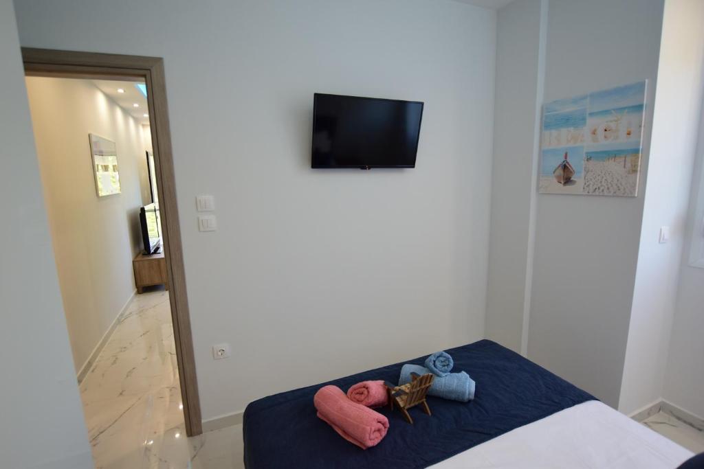 Postel nebo postele na pokoji v ubytování V Luxury Suites Toroni 1