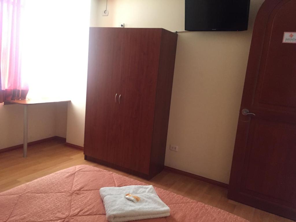 Postel nebo postele na pokoji v ubytování Hotel Arunta