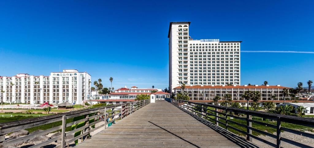a bridge in a city with buildings in the background at Rosarito Beach Hotel in Rosarito
