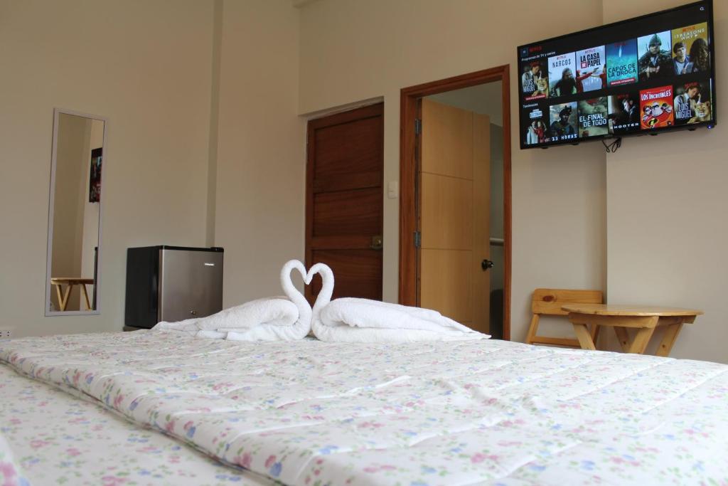 Postel nebo postele na pokoji v ubytování Residencial Marina House
