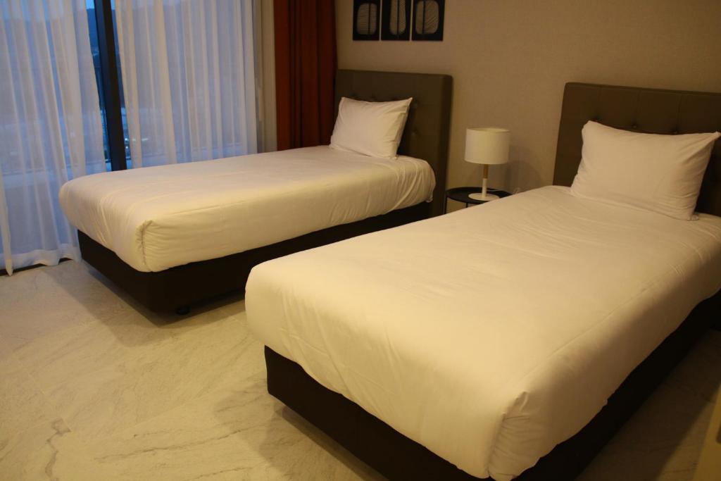 Postel nebo postele na pokoji v ubytování AM Hotel