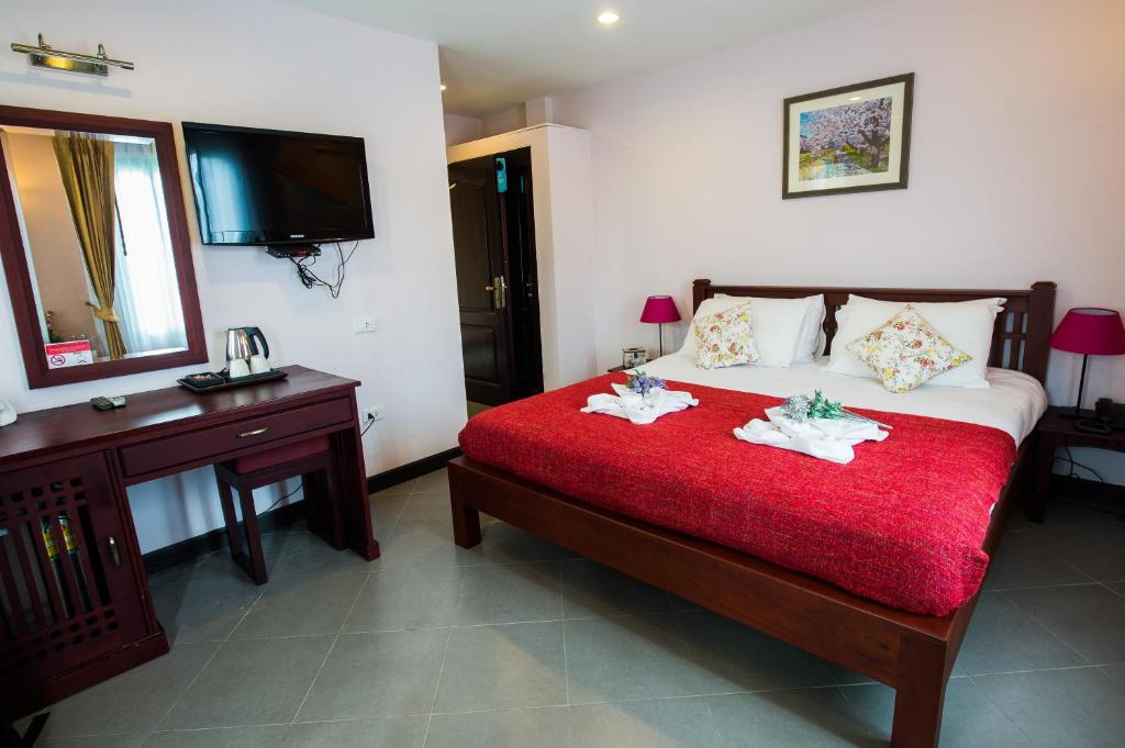Postel nebo postele na pokoji v ubytování La Villa Boutique hotel