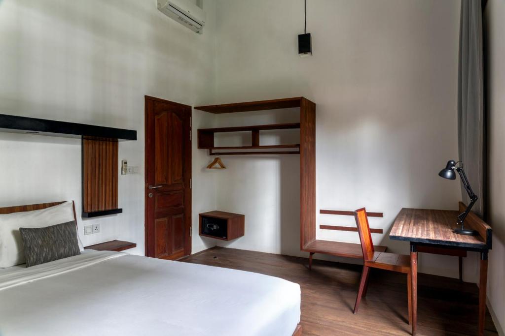 Postel nebo postele na pokoji v ubytování Pages Rooms Hotel