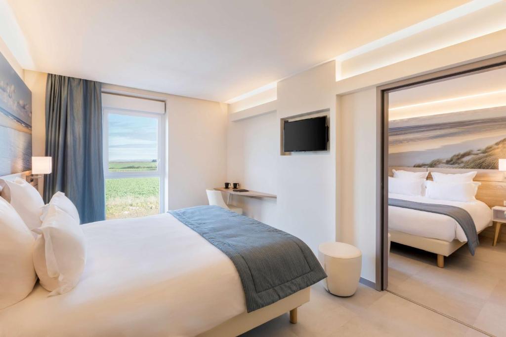 Postel nebo postele na pokoji v ubytování Best Western le Sémaphore