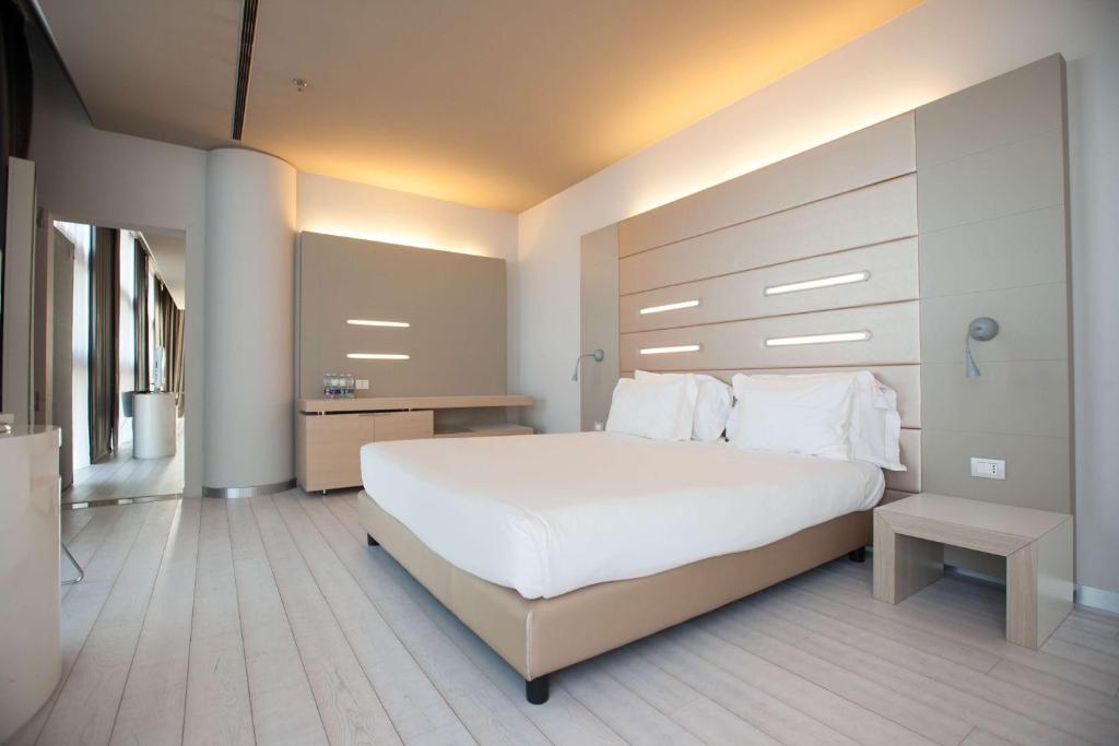Krevet ili kreveti u jedinici u okviru objekta Best Western Plus Net Tower Hotel Padova