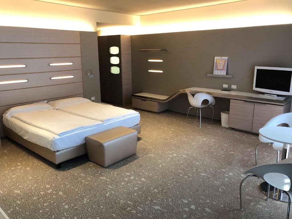 Krevet ili kreveti u jedinici u okviru objekta Best Western Plus Net Tower Hotel Padova