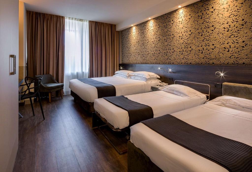 Łóżko lub łóżka w pokoju w obiekcie Best Western Plus Hotel Farnese
