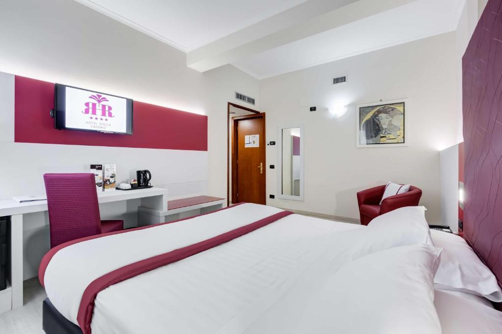 Postel nebo postele na pokoji v ubytování Best Western Hotel Rocca