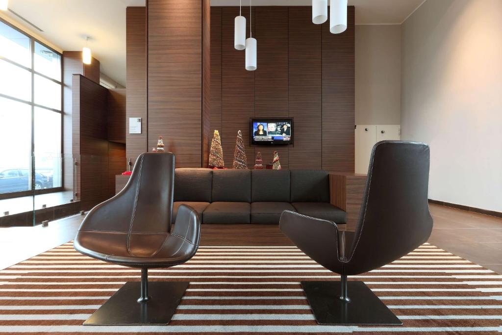 TV a/nebo společenská místnost v ubytování Best Western Plus Hotel Monza e Brianza Palace
