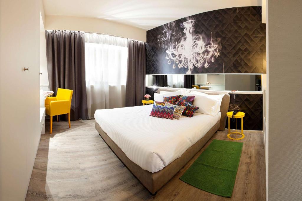 Postel nebo postele na pokoji v ubytování Albavilla Hotel & Co