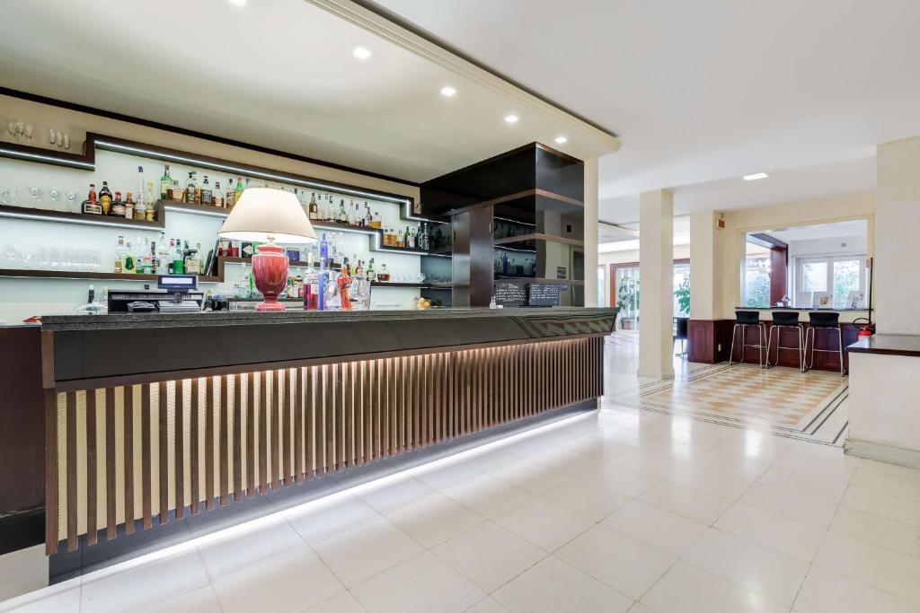 a bar in a hotel lobby with a counter at Villa Maria Hotel & SPA in Francavilla al Mare