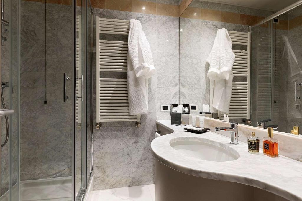 Koupelna v ubytování Albavilla Hotel & Co