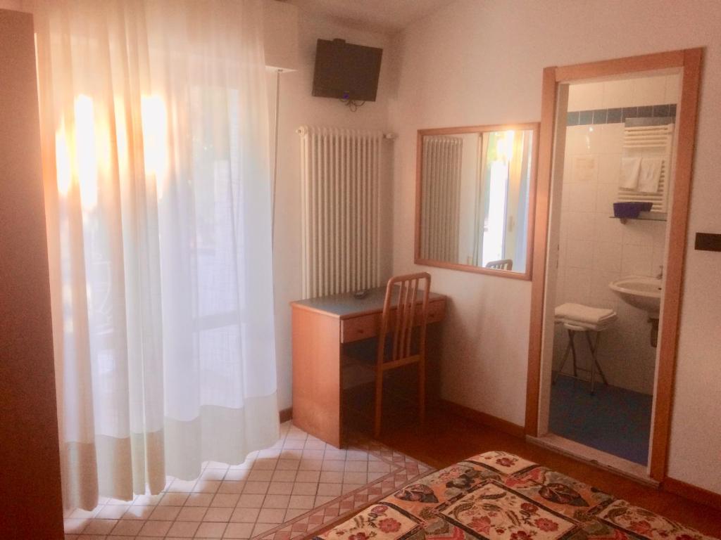 Postel nebo postele na pokoji v ubytování Hotel Daniela