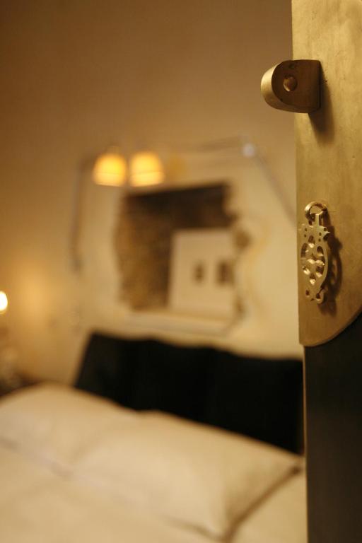 Postel nebo postele na pokoji v ubytování Mikro Papigo 1700 Hotel & Spa