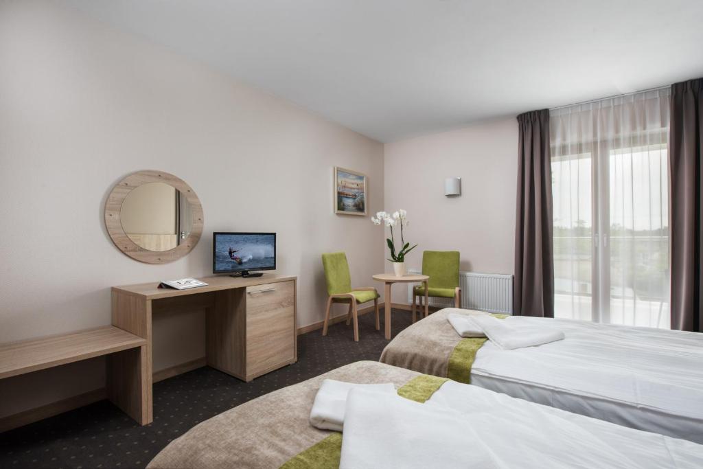 Postel nebo postele na pokoji v ubytování Hotel Szafir