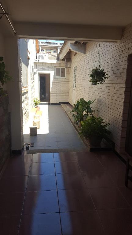 an empty hallway of a building with a courtyard at Scarecrow Homestay in Jincheng