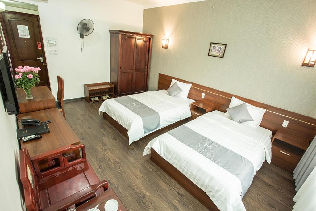 Postel nebo postele na pokoji v ubytování My Lan Hanoi Hotel