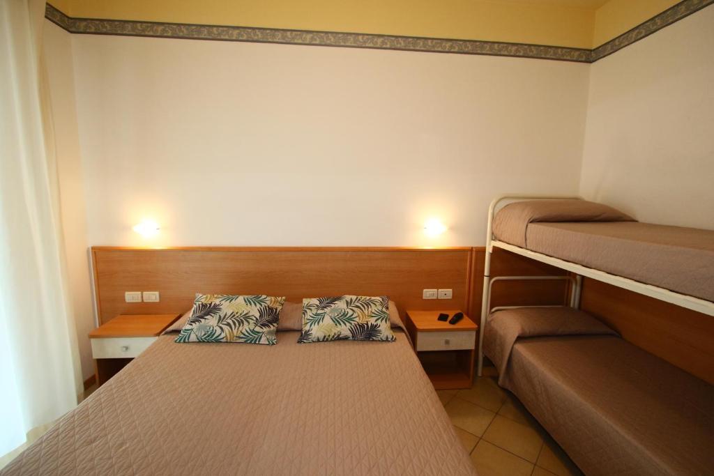 Postel nebo postele na pokoji v ubytování Hotel Boom