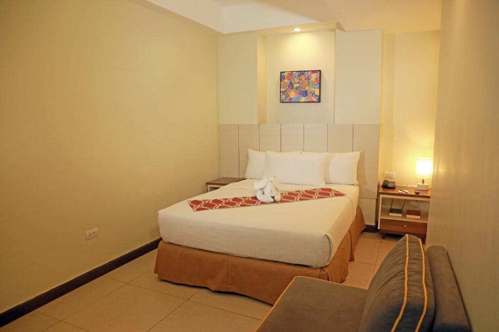Postel nebo postele na pokoji v ubytování Belian Hotel