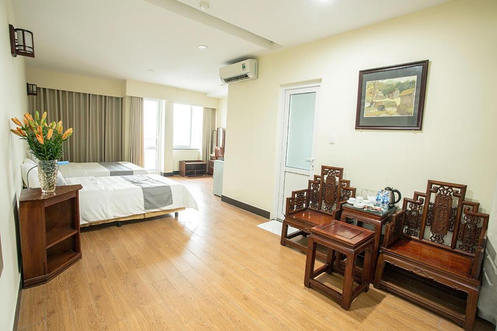 Postel nebo postele na pokoji v ubytování My Lan Hanoi Hotel