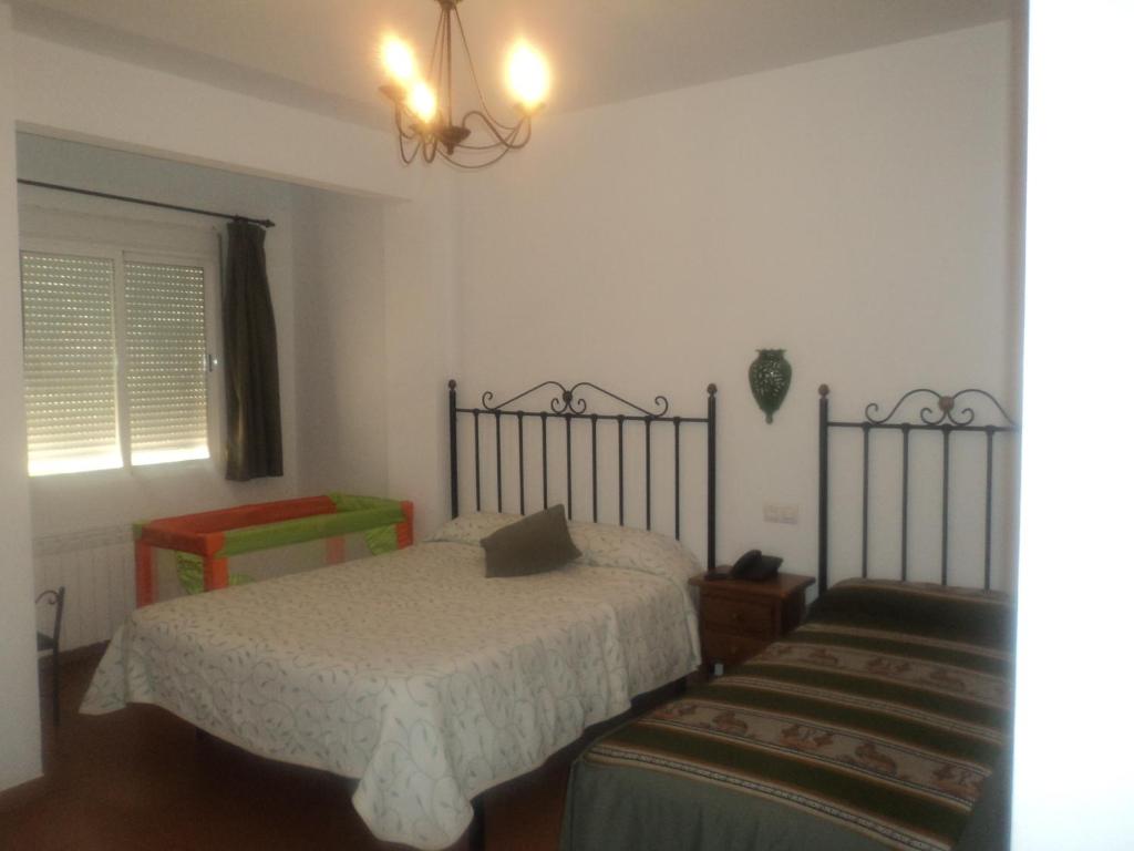 Postel nebo postele na pokoji v ubytování Hotel San Julian