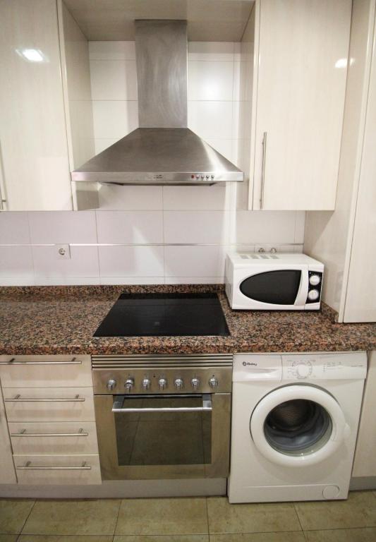 Kuchnia lub aneks kuchenny w obiekcie Expoholidays - Apartamentos en primera linea