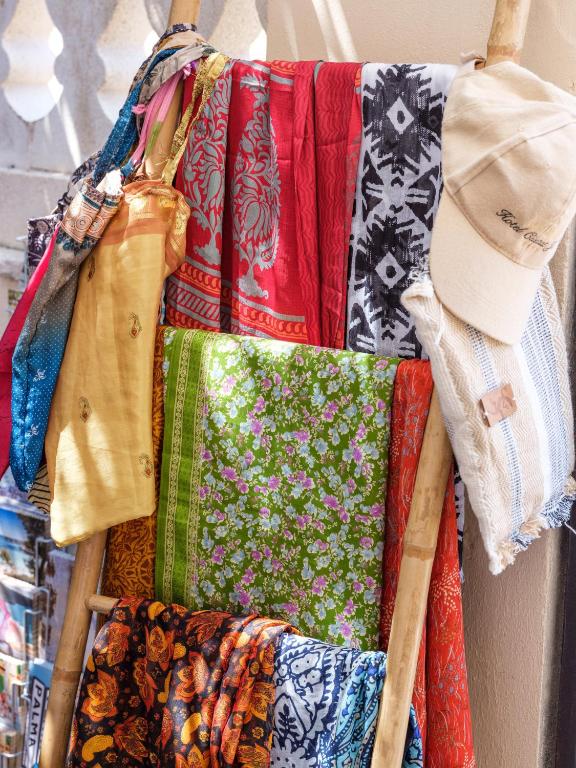 a bunch of ties are hanging on a wall at Hotel Ciutat Jardi in Palma de Mallorca