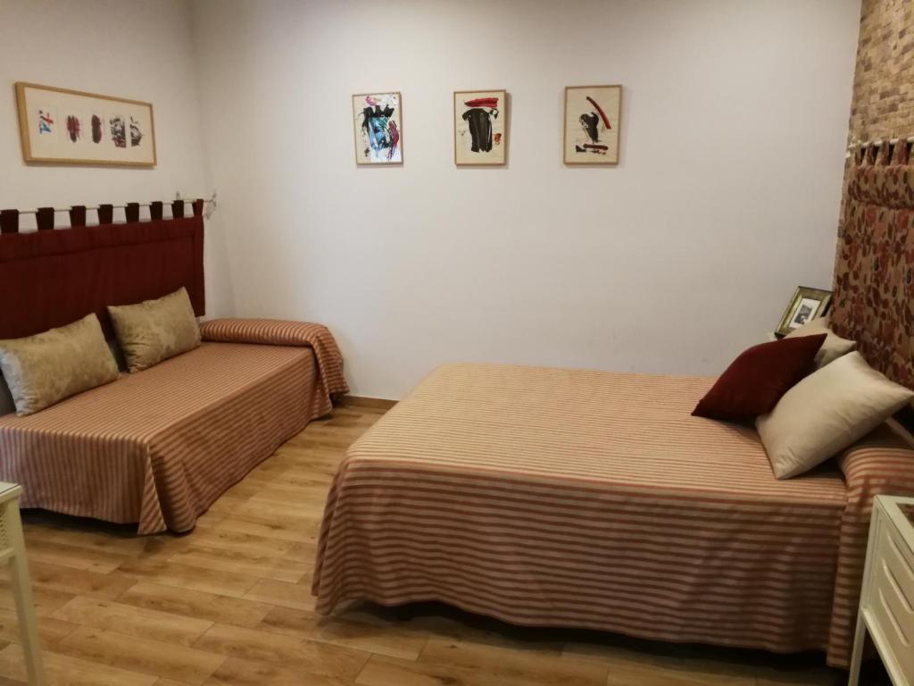 Postel nebo postele na pokoji v ubytování Hostal Maestre