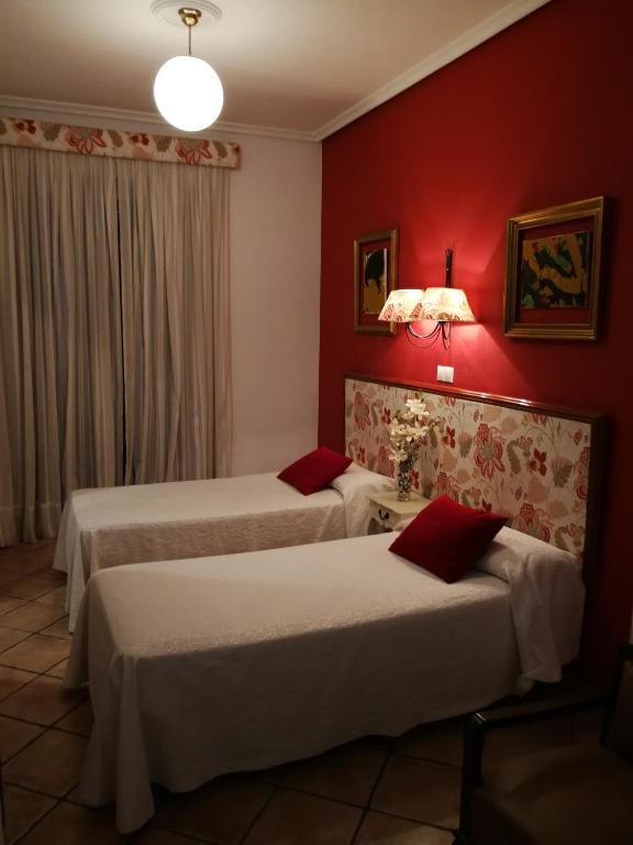 Postel nebo postele na pokoji v ubytování Hostal Maestre