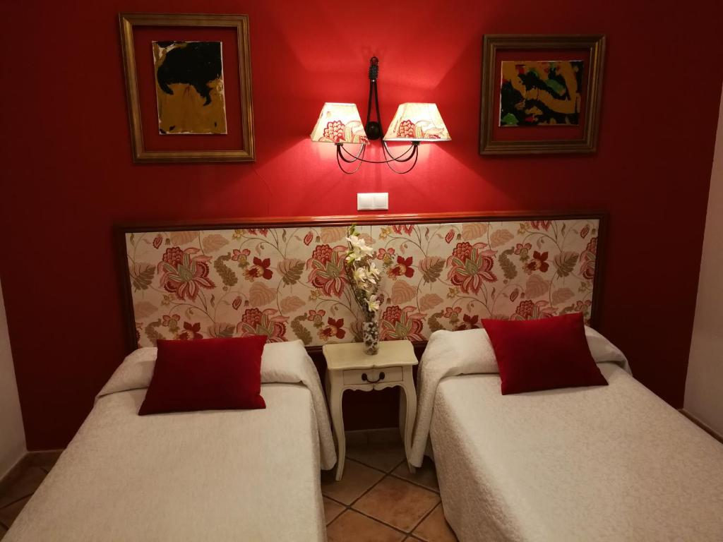 Postel nebo postele na pokoji v ubytování Hostal Maestre