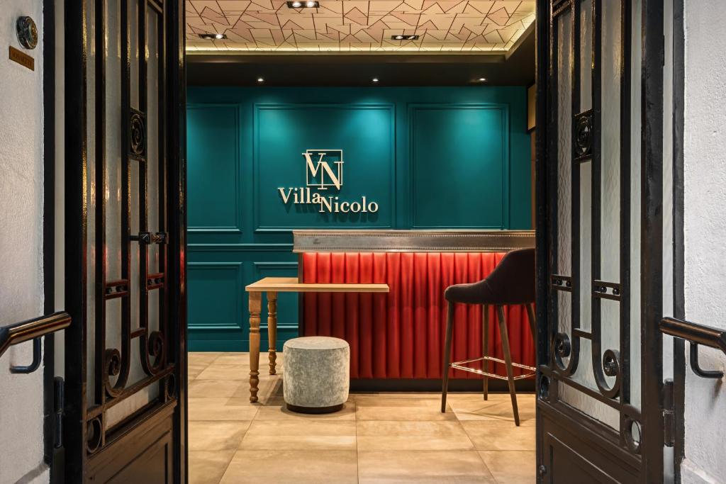 a view of a room with a red and blue wall at Hotel Villa Nicolo - Tour Eiffel in Paris