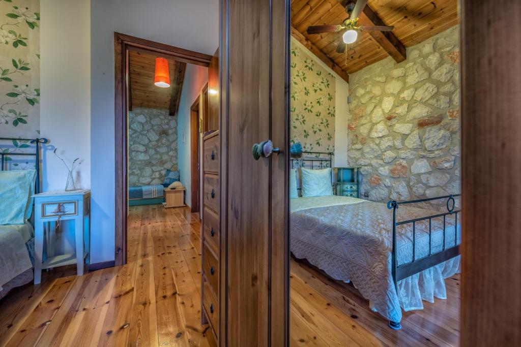Postel nebo postele na pokoji v ubytování ORFEAS Villa